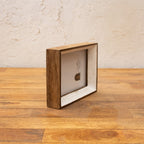 Angled side view of the Niche natural wood and white photo frame