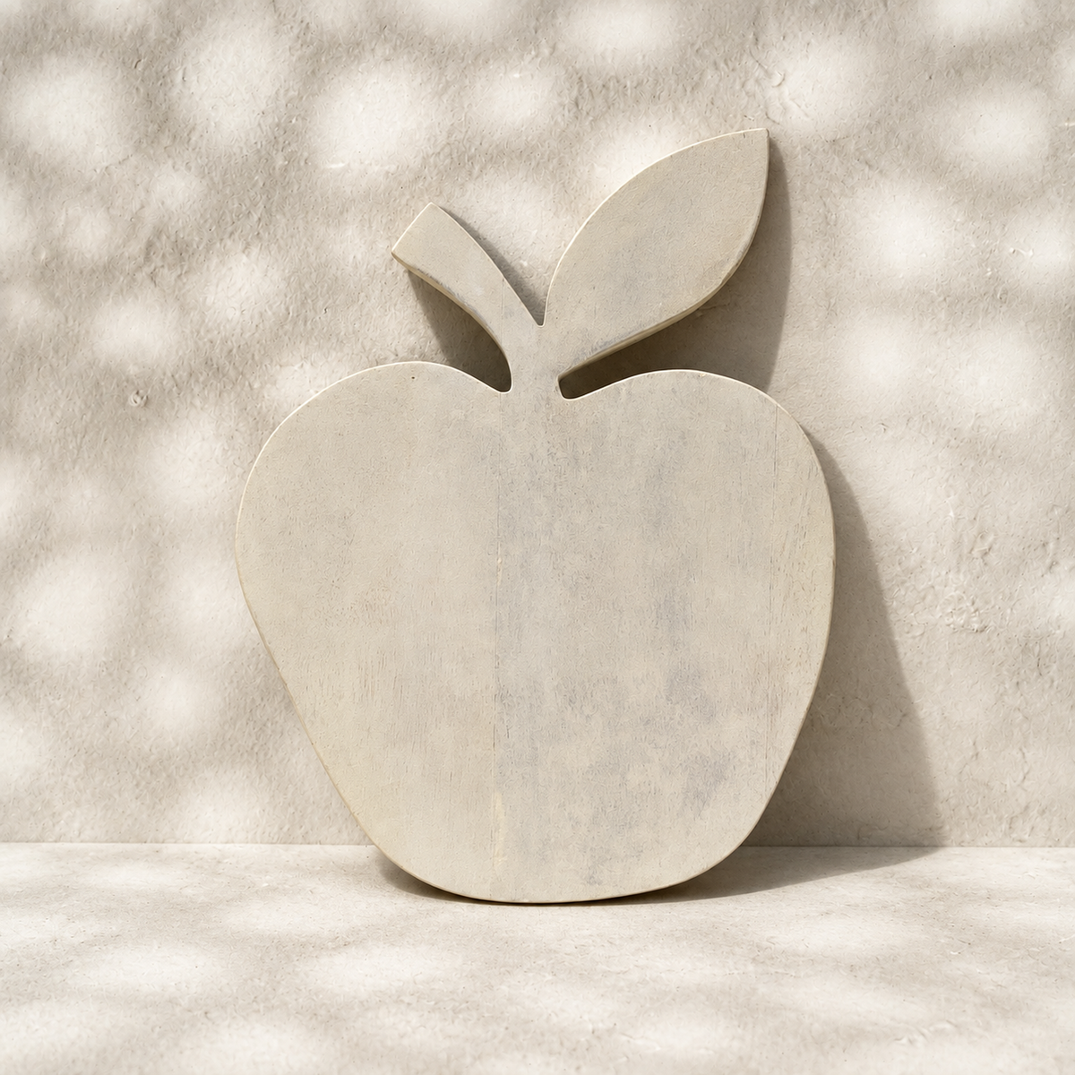 Front view of the plain whitewashed Orchard apple-shaped wooden trivet