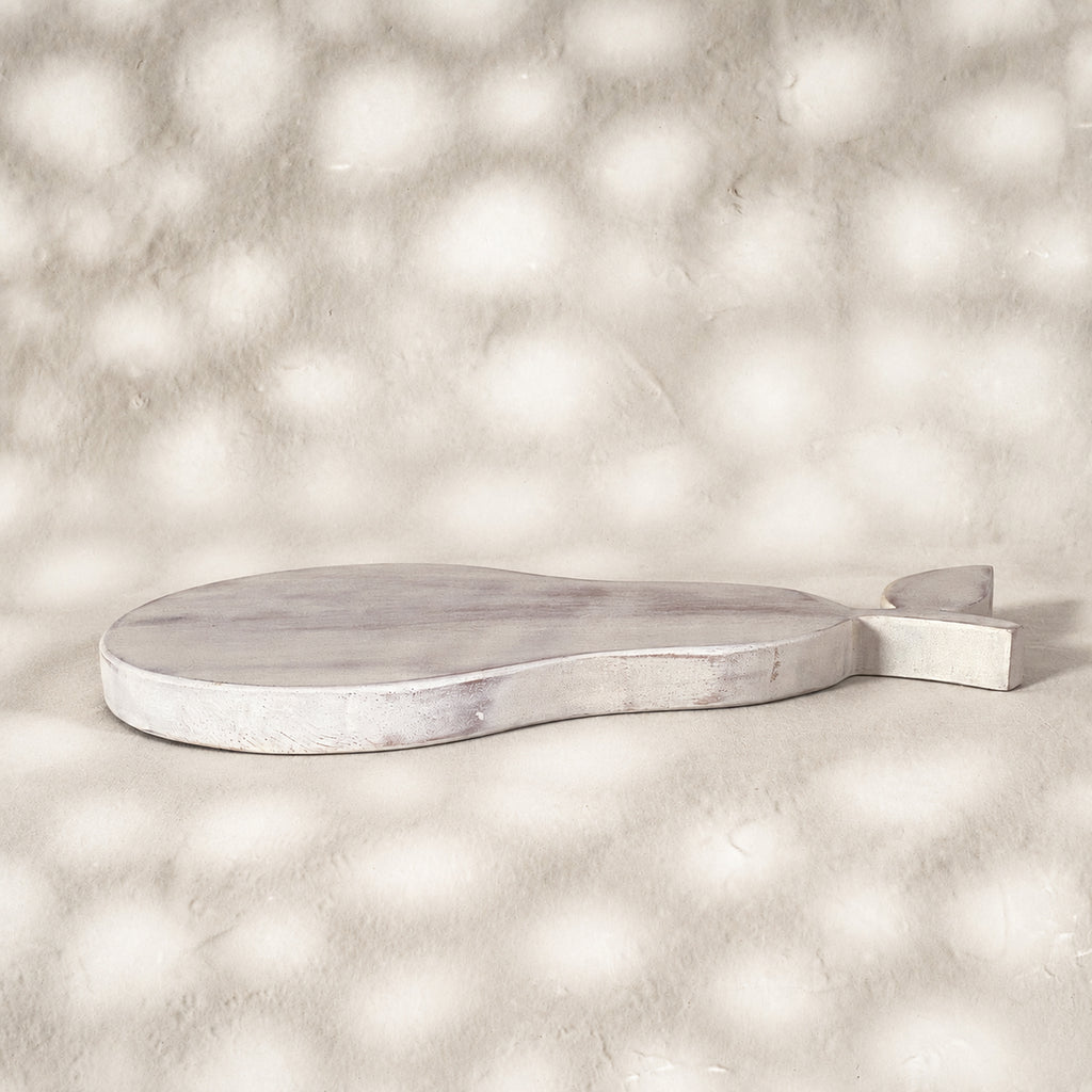 Low side view of the whitewashed Orchard pear-shaped wooden trivet
