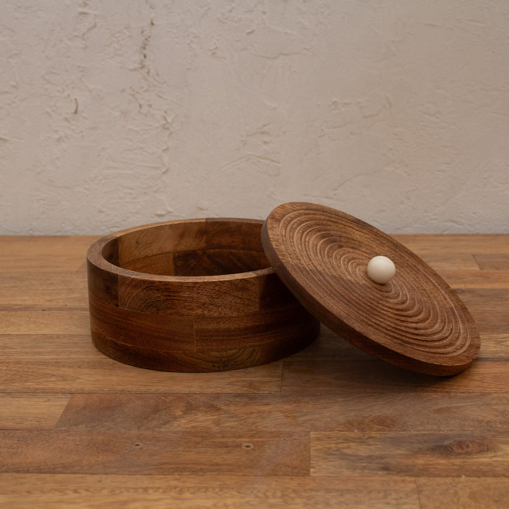 Round wooden roti box displayed open with its lid beside it