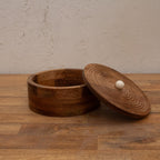 Round wooden roti box displayed open with its lid beside it