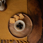 Wooden chip and dip platter styled with biscuits and a filled bowl
