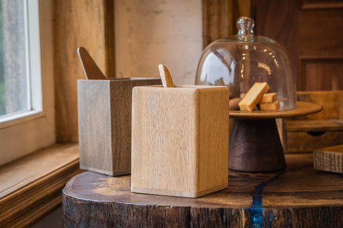 Two Cove wooden cutlery caddies styled with utensils