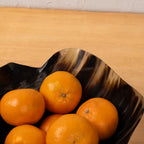 Close-up of oranges inside the fluted resin serving bowl