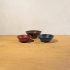 Three large wooden bowls displayed together