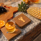 Marine wooden trivet placed beneath a teapot on a table