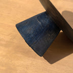 Close-up of the base of the Midnight wooden cake stand