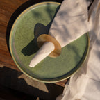 Orbit horn napkin ring styled with a folded napkin on a plate