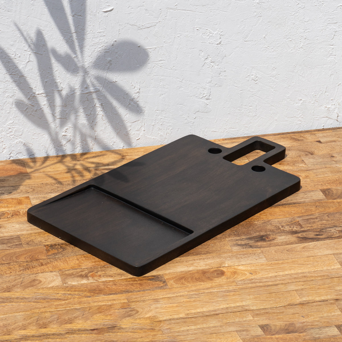 Angled view of the oversized wooden butcher board