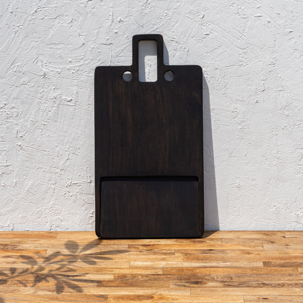 Oversized wooden butcher board standing upright