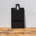 Oversized wooden butcher board standing upright