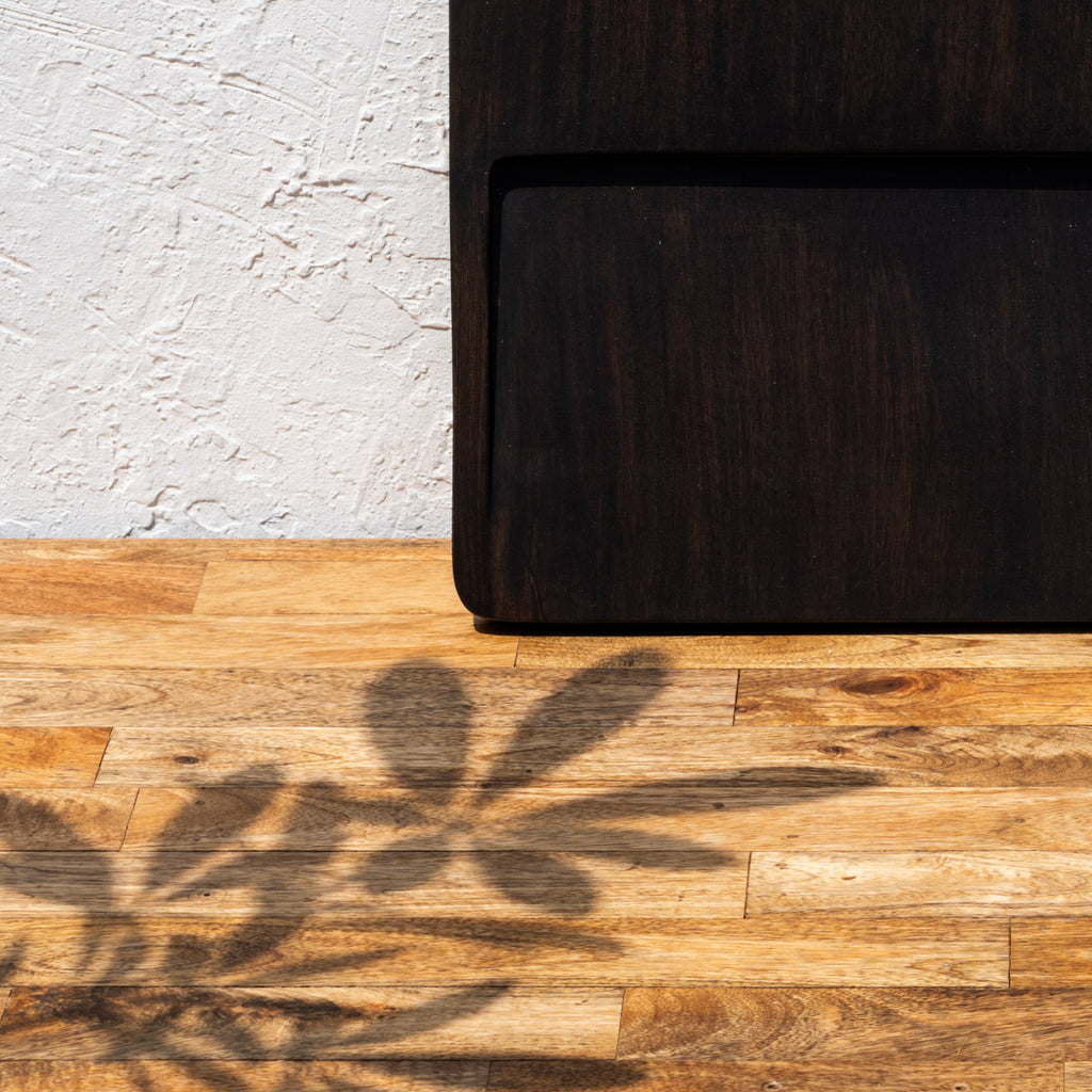 Close-up of the corner of the oversized wooden butcher board