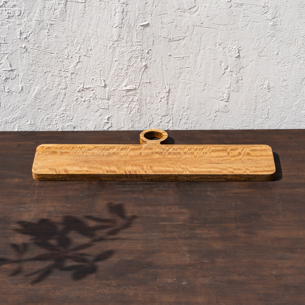 Front view of the oversized wooden cheese board