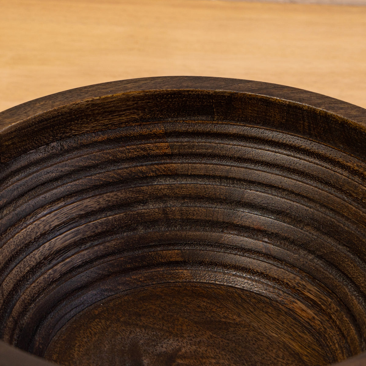 Close-up of the carved ridges inside the Ridge wooden bowl
