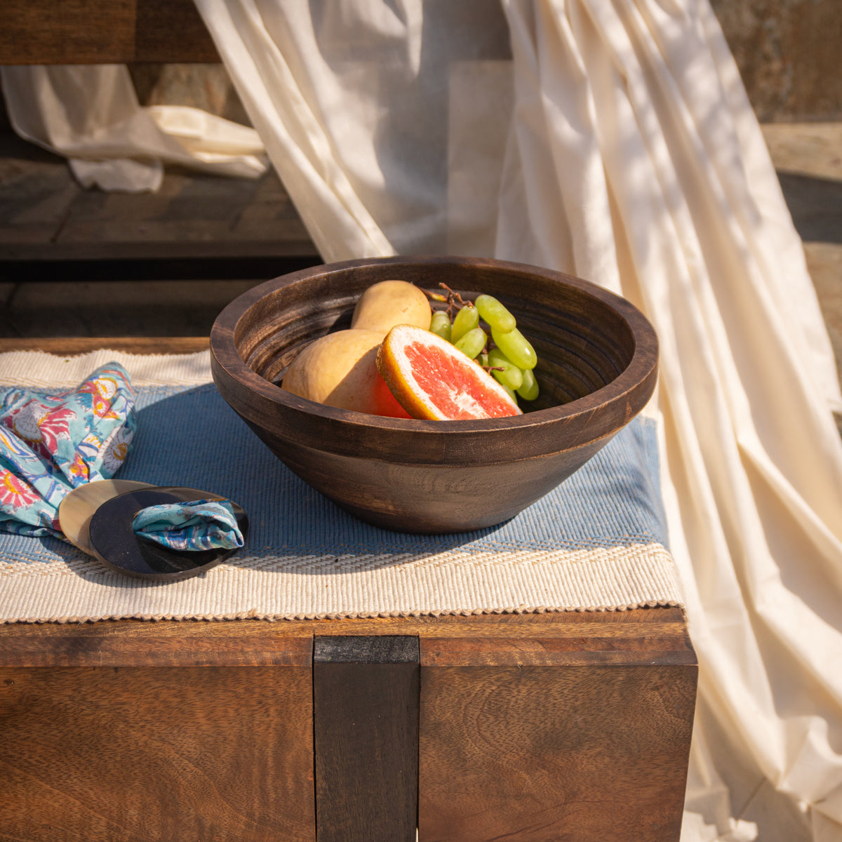 Ridge wooden bowl styled with fruit on a table