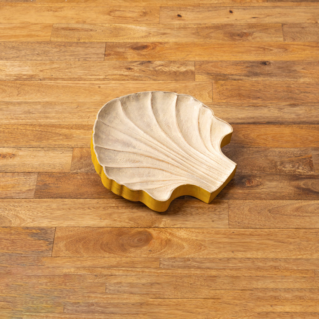 Top view of the empty shell-shaped wooden serving platter