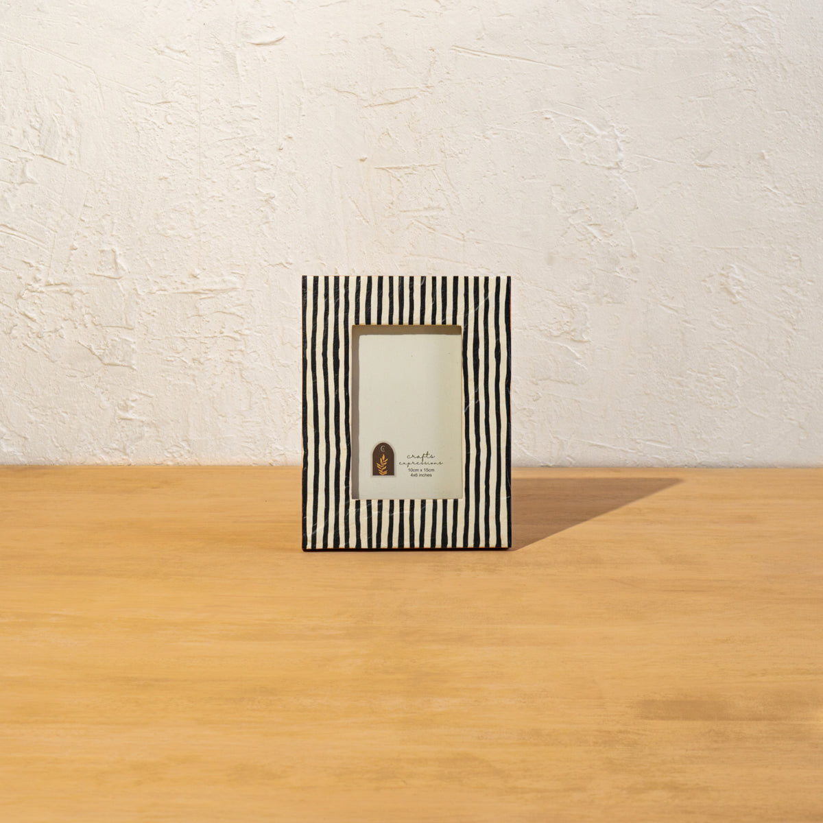 Front view of the striped wooden photo frame displayed vertically