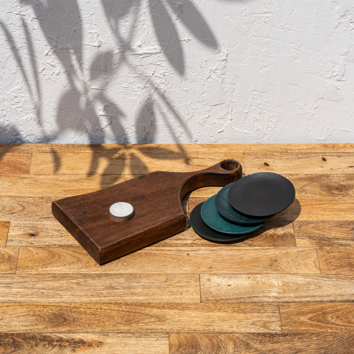 Twinkle wooden serving board styled with stacked coasters