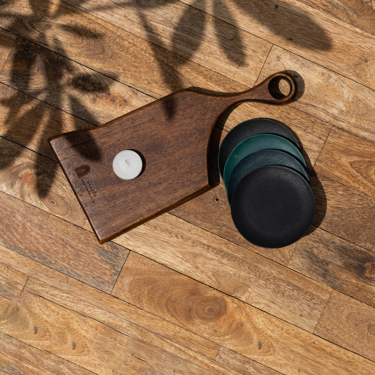 Twinkle wooden serving board and coasters displayed together