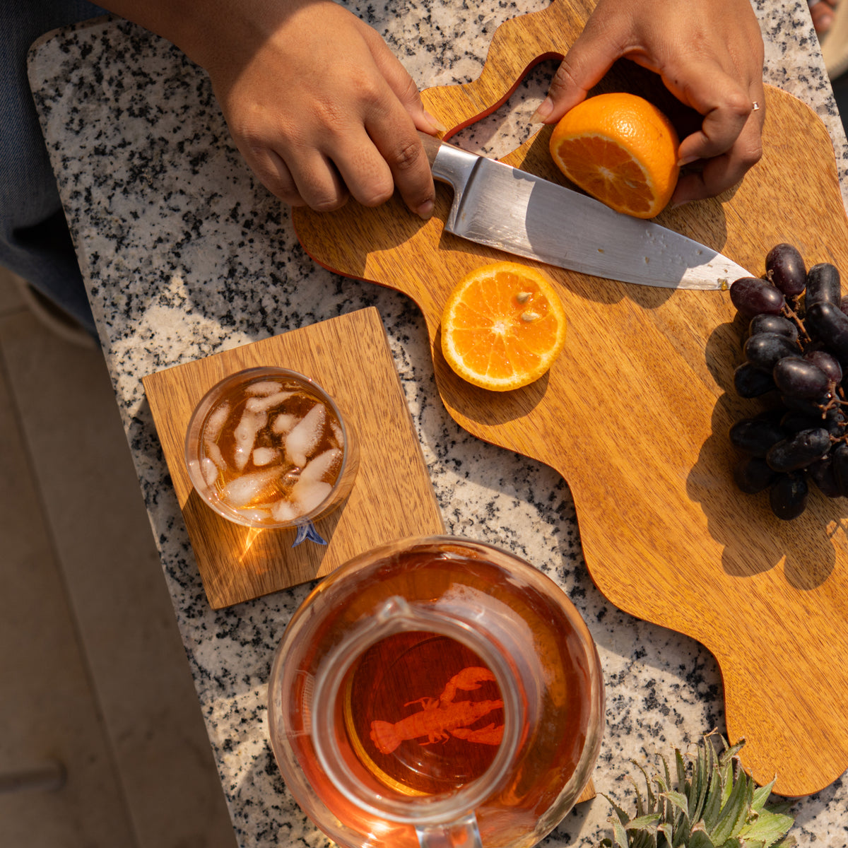 Wavy wooden platter styled with food on a table