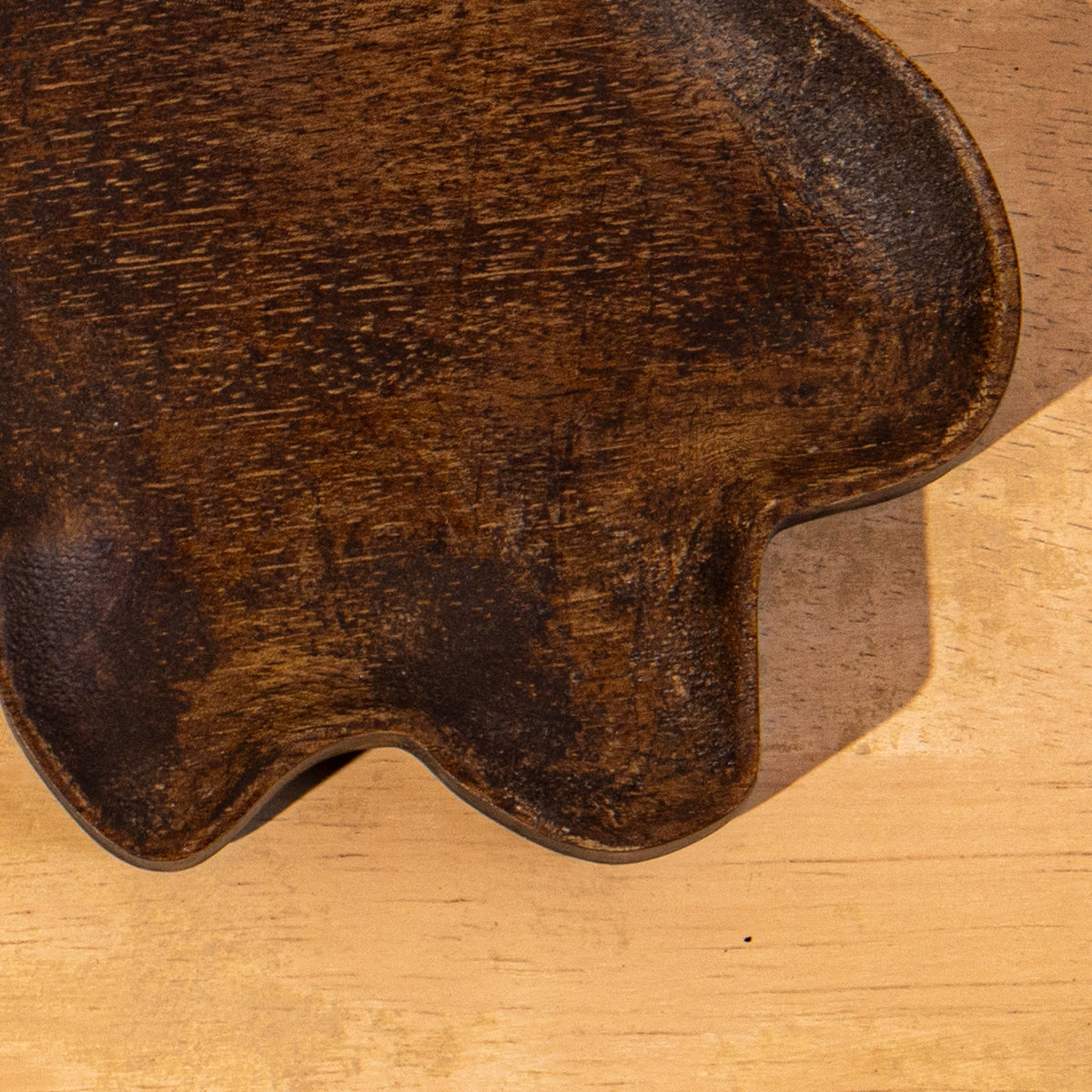 Close-up of the carved surface of the Wavy wooden spoon rest