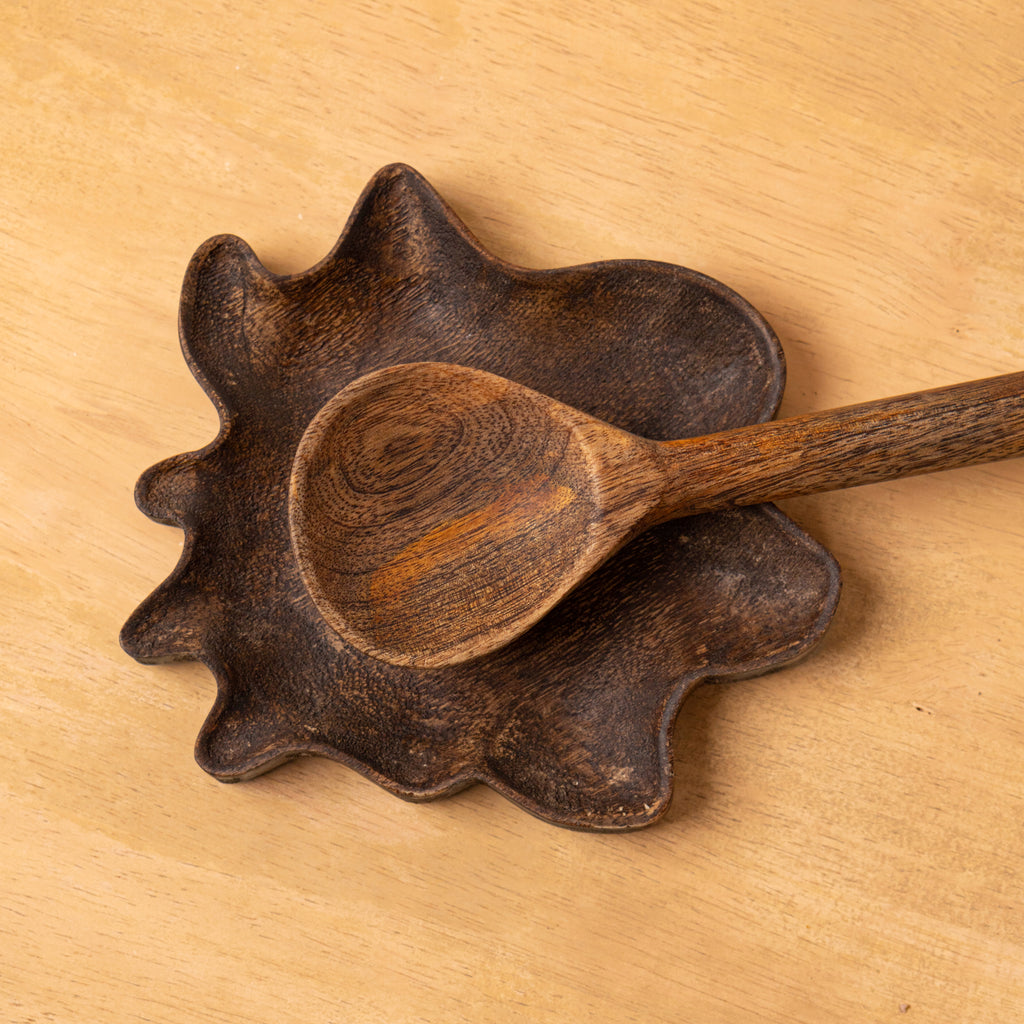 Top view of the Wavy wooden spoon rest holding a spoon